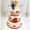 Свадебный торт "Любовь-это...муж и жена" трехъярусный с фигурками и сердечками СТ567